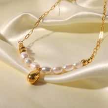 Load image into Gallery viewer, Stainless steel necklace is made as an interesting combination of chain and gold and white pearls. It is additionally adorned with a gold pendant in a shape of a teardrop.&nbsp; This beautiful and charming necklace is a great accessory for evening night out. The necklace has a lobster clasp and adjustable length.
