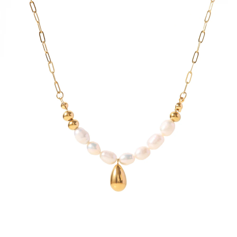 Stainless steel necklace is made as an interesting combination of chain and gold and white pearls. It is additionally adorned with a gold pendant in a shape of a teardrop.  This beautiful and charming necklace is a great accessory for evening night out. The necklace has a lobster clasp and adjustable length.