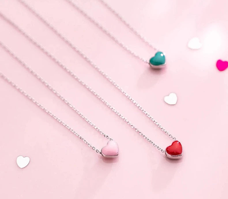 This beautiful and elegant necklace is made of 925 sterling silver. It comes in three variants: pink, red and green. It has very delicate chain and simple pendant which makes this necklace a. perfect accessories for an elegant occasion outfit. The necklace has an adjustable chain with a lobster clasp.