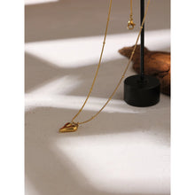 Load image into Gallery viewer, This elegant 18K gold plated necklace is made of stainless steel and comes in two colours: gold and silver. Chain is decorated with small balls and has pedant in a shape of a heart. The necklace has lobster clasp and adjustable size. It can be worn with daily and evening outfits.
