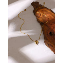 Load image into Gallery viewer, This elegant 18K gold plated necklace is made of stainless steel and comes in two colours: gold and silver. Chain is decorated with small balls and has pedant in a shape of a heart. The necklace has lobster clasp and adjustable size. It can be worn with daily and evening outfits.
