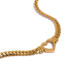 Load image into Gallery viewer, Stainless steel 18K gold plated necklace comes in a gold and silver colour. It is made of a thick and big chain which is adorned with a heart contour in the middle. This luxurious necklace is perfect accessory for any evening gown. It has lobster clasp and adjustable length.
