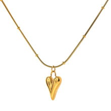 Load image into Gallery viewer, This elegant 18K gold plated necklace is made of stainless steel and comes in two colours: gold and silver. Chain is decorated with small balls and has pedant in a shape of a heart. The necklace has lobster clasp and adjustable size. It can be worn with daily and evening outfits.
