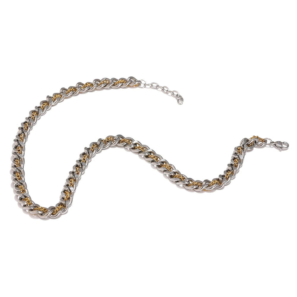 This chain necklace is made of stainless steel. It is made as a combination of silver and gold chain which makes it very interesting and wearable. It is a perfect piece for an everyday outfit as it can be easily combined due to dual colours. The necklace has a size adjustable chain with a lobster clasp. 