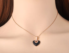 Load image into Gallery viewer, Beautiful and elegant 18K plated stainless steel necklace comes in two versions: with black or silver heart. Chic heart pendant is made of cubic zirconia and it is additionally adorned with a stainless steel circle in rose gold colour. Circe has engraved roman numerals and gives the necklace perfect final touch. It is a perfect piece for an elegant occasion outfit. The necklace has a size adjustable chain with a lobster clasp.&nbsp;
