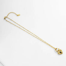 Load image into Gallery viewer, This lovely vintage necklace is made out of stainless steel and is real gold plated. Its chain is adorned with small balls and interesting clasp at the bottom of the necklace. There is a heart pendant hanging on that clasp with a small black stone in the middle. This interesting vintage necklace can be worn with an everyday outfit but also makes a great accessory for evening night out. It has a size adjustable lobster clasp
