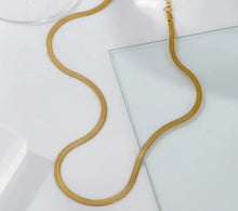 Load image into Gallery viewer, This elegant necklace is made of 18K gold plated stainless steel. It comes in two colours, gold and silver. This necklace is a perfect piece for any daily or evening combination. The necklace has a size adjustable chain with a lobster clasp. Adjustable chain is additionally adorned with a small heart.
