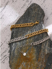 Load image into Gallery viewer, This beautiful statement chain necklace is made of stainless steel. The necklace is made as a combination of silver and gold thick chain which makes it interesting and wearable with many outfits. It is a perfect piece for an everyday outfit. The necklace has a size adjustable chain with a lobster clasp.&nbsp;
