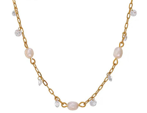 This romantic 18K gold plated stainless steel necklace comes in a gold colour. It is made as a combination of chain and natural freshwater pearls. The necklace is additionally adorned with little cubic zirconia that are attached to the chain. The necklace is perfect for spicing up your daily or evening outfit. It has lobster clasp and adjustable length.