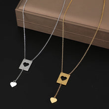 Load image into Gallery viewer, This elegant stainless steel necklace comes in two colours: silver and gold. Its very simple and elegant design is additionally adorned with two pendants: rectangle with a carved heart and a nice heart pendant which hangs from it on a separate chain. It is a perfect piece for an elegant occasion outfit. The necklace has a lobster clasp.
