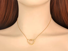 Load image into Gallery viewer, Stainless steel necklace comes in two colours: gold and silver. This simple and elegant necklace is adorned with a twisted hollow heart pendant. It is a perfect piece for an elegant occasion outfit as well as for daily combinations. The necklace has a size adjustable chain with a lobster clasp.&nbsp;
