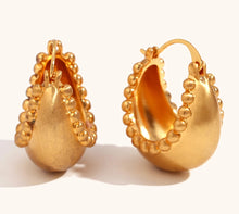 Load image into Gallery viewer, These trendy hoop earrings feature a charming basket boat shape with a unique edge design accented by small, delicate ball details. Crafted from durable stainless steel, they bring a playful yet sophisticated touch to any outfit, making them perfect for adding interest to everyday looks. 
