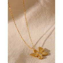 Load image into Gallery viewer, This romantic 18K gold plated stainless steel necklace comes in a gold colour. Its delicate and thin chain is adorned with a beautiful carved butterfly pendant that is additionally adorned with small artificial pearls and cubic zirconia. The chain necklace is perfect for spicing up your daily or evening outfit. It has lobster clasp and adjustable length.
