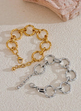 Load image into Gallery viewer, Make a bold style statement with this trendy metal round links bracelet, featuring oversized, notched links that create a striking and modern look. Crafted from high-quality stainless steel, this bracelet is designed to be both waterproof and durable, ensuring it maintains its shine through everyday wear. Its unique, individualistic design makes it the perfect accessory for those who love to stand out with distinctive, fashion-forward pieces.
