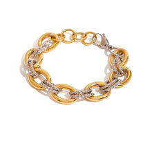 Load image into Gallery viewer, Add modern elegance to your jewelry collection with this two-color twisted necklace, crafted from premium stainless steel with luxurious 18K gold-color plating. Featuring a stylish twisted splicing design, this stackable waterproof necklace is made for everyday wear and effortless layering without tarnishing. Perfect for casual or dressy looks, it’s a versatile statement piece for women who love durable, on-trend stainless steel jewelry with a polished finish.
