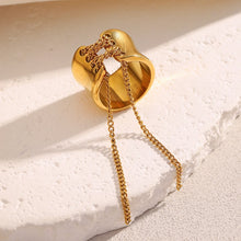 Load image into Gallery viewer, Add a bold yet elegant touch to your everyday style with this tassel wrapped stainless steel women’s Rrng. Featuring a unique wrapped design with trendy tassel detailing, this ring is crafted from durable stainless steel and finished with luxurious PVD gold plating for long-lasting shine. Versatile and fashionable, it’s perfect for daily wear or special occasions and makes a thoughtful gift for women who love modern, multifunctional jewelry.
