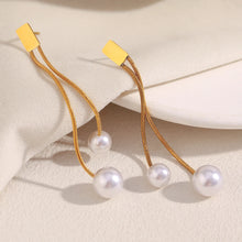 Load image into Gallery viewer, Add timeless elegance to your look with these tassel imitation pearl earrings, designed to elevate both everyday and special occasion outfits. Made from durable stainless steel with a luxurious gold-plated finish, they feature graceful tassels and lustrous imitation pearls for a refined, fashionable touch. Lightweight and comfortable to wear, these earrings are a perfect accessory for modern women and make a beautiful gift for any occasion.
