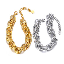 Load image into Gallery viewer, Make a bold statement with this oval circle handmade chain bracelet, meticulously crafted with alternating notched links for added texture and style. Plated in luxurious 18K gold, this stunning piece exudes sophistication and elegance, while the stainless steel construction ensures it remains waterproof and tarnish-free for lasting beauty. Perfect for any occasion, this eye-catching bracelet offers both durability and fashion-forward design, making it a versatile accessory for daily wear or special events.
