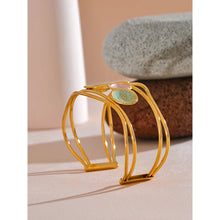 Load image into Gallery viewer, Make a bold statement with our gold-plated stainless steel colorful enamel open angle, designed for fashionable women who love eye-catching accessories. This stylish bangle features an exaggerated, large design adorned with five vibrant enamel circles in red, purple, turquoise, green, and pink, adding a playful splash of color to any outfit. Perfect for making a statement at any occasion, this chic and modern bracelet is a must-have for those who want to stand out with elegance and creativity.
