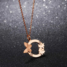 Load image into Gallery viewer, This elegant 18K gold plated necklace is made of stainless steel and comes in a rose gold colour. It is adorned with a beautiful pendant in a shape of a circle. There are three butterflies on the circle as well as two cubic zirconia which makes this pendant very elegant and classy. This necklace is a perfect accessory for a glamorous outfit. It has a size adjustable chain with a lobster clasp.&nbsp;
