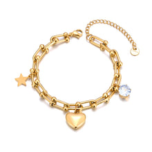 Load image into Gallery viewer, Add a touch of elegance and charm to your look with this stainless steel cubic zirconia crystal charm bracelet. Plated in radiant 18K gold, this delicate chain bracelet features a trio of enchanting charms—a sparkling zircon, a shining star, and a timeless heart. Perfect for everyday wear or special occasions, this bracelet combines durability and style, making it a versatile addition to any jewelry collection or a thoughtful gift for someone special.
