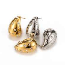 Load image into Gallery viewer, These chic chubby waterdrop stud earrings bring a touch of elegance with their sleek gold and silver color options and embedded zircon accents that add a hint of sparkle. Crafted from durable stainless steel, they’re designed to be both stylish and long-lasting, making them a versatile accessory for any occasion.
