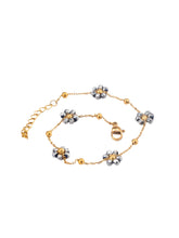 Load image into Gallery viewer, Elevate your look with this delicate stainless steel bracelet, beautifully gold-plated for a touch of luxury and adorned with intricate small grey beaded flowers. The fine craftsmanship of the floral accents adds a subtle charm, making this bracelet an elegant addition to any outfit. Its refined design is perfect for everyday wear or special occasions, offering a graceful balance between simplicity and sophistication.
