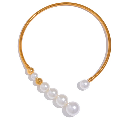 Beautiful statement necklace is made of stainless steel and artificial pearls. The necklace is opened in front and has a row of pearls mixed with stainless steel beads. Pearls are getting bigger and bigger towards the end of the necklace which makes it perfect jewelry piece for your evening gown.