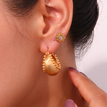 Load image into Gallery viewer, These trendy hoop earrings feature a charming basket boat shape with a unique edge design accented by small, delicate ball details. Crafted from durable stainless steel, they bring a playful yet sophisticated touch to any outfit, making them perfect for adding interest to everyday looks. 
