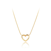 Load image into Gallery viewer, Stainless steel necklace comes in two colours: gold and silver. This simple and elegant necklace is adorned with a twisted hollow heart pendant. It is a perfect piece for an elegant occasion outfit as well as for daily combinations. The necklace has a size adjustable chain with a lobster clasp.&nbsp;
