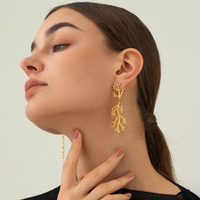 Load image into Gallery viewer, These trendy drop earrings feature a unique coral-textured design, plated in radiant 18K gold and adorned with delicate inlaid pearls for a touch of elegance. Crafted from high-quality stainless steel, they combine durability with sophistication, making them perfect for women who love standout accessories. Ideal as a thoughtful gift, these earrings add a luxurious and modern flair to any outfit.
