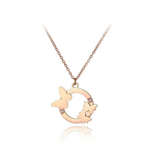 Load image into Gallery viewer, This elegant 18K gold plated necklace is made of stainless steel and comes in a rose gold colour. It is adorned with a beautiful pendant in a shape of a circle. There are three butterflies on the circle as well as two cubic zirconia which makes this pendant very elegant and classy. This necklace is a perfect accessory for a glamorous outfit. It has a size adjustable chain with a lobster clasp.&nbsp;
