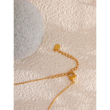 Load image into Gallery viewer, This beautiful handmade necklace, crafted from stainless steel, features a delicate double chain design that exudes elegance and sophistication. The thin chains are adorned with shimmering golden cubes and natural freshwater pearls, creating a striking balance of modern charm and timeless grace. Perfect for glamorous occasions, this necklace adds a touch of refined class to any ensemble.
