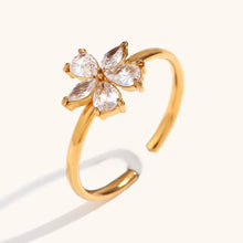 Load image into Gallery viewer, Add a touch of elegance to your look with this five petal zircon ring, crafted from durable stainless steel for a sleek and lasting finish. Featuring a delicate five-petal flower design adorned with sparkling zircon, this ring is both stylish and waterproof, perfect for daily wear. A timeless accessory that enhances any outfit, making it an ideal gift or a beautiful addition to your jewelry collection.
