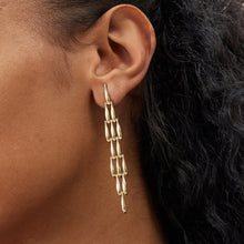 Load image into Gallery viewer, These creative teardrop earrings feature an intricate mesh design, plated in gold for a luxurious yet lightweight look. Crafted from high-quality stainless steel, they include delicate long tassels that add movement and elegance, making them a standout accessory for any occasion. Perfect for those who love stylish, eye-catching jewelry, these earrings offer a chic blend of modern flair and timeless charm, ideal for effortlessly enhancing any outfit.
