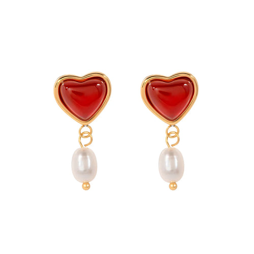 Embrace timeless romance with these stainless steel inlaid onyx heart shape freshwater pearl earrings. Featuring a stunning combination of glossy onyx hearts and delicate freshwater pearls, these earrings exude elegance and charm. Crafted from durable stainless steel, they offer a sophisticated, tarnish-resistant finish, making them perfect for any occasion. A thoughtful and stylish gift for someone special or a beautiful addition to your jewelry collection.