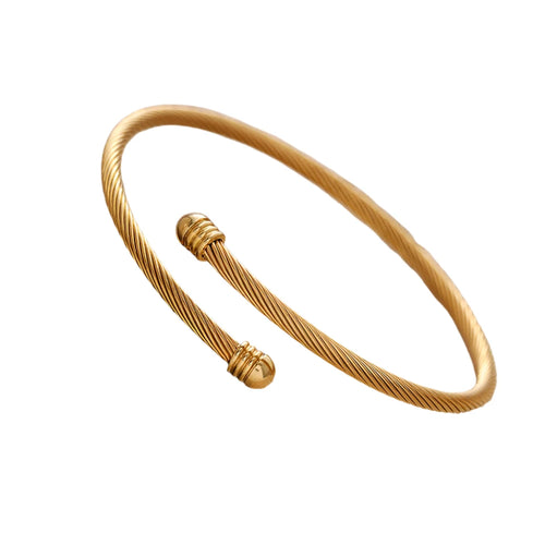 Elevate your style with this stainless steel vintage fashion open bangle, available in both silver and gold finishes. Designed with a blend of simplicity and sophistication, this bracelet features delicate decal wire details that add a touch of vintage charm to its sleek, minimalist form. Its open bangle design allows for easy wear and an adjustable fit, making it a versatile accessory for any occasion.