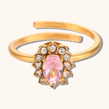 Load image into Gallery viewer, Add a touch of elegance to your look with this luxurious gold plated flower oval zircon ring. Crafted from durable stainless steel, this stunning piece features a sparkling oval zircon centerpiece surrounded by delicate floral details. Perfect for parties or special occasions, it exudes sophistication and charm, making it a must-have accessory for any woman’s jewelry collection.
