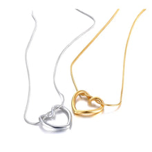 Load image into Gallery viewer, Stainless steel necklace comes in two colours: gold and silver. This simple and elegant necklace is adorned with a twisted hollow heart pendant. It is a perfect piece for an elegant occasion outfit as well as for daily combinations. The necklace has a size adjustable chain with a lobster clasp.&nbsp;
