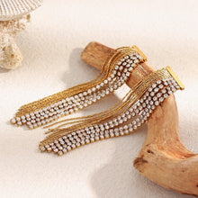 Load image into Gallery viewer, Add a touch of effortless elegance to your everyday look with these zircon chain tassel earrings. Crafted from high-quality stainless steel, they feature shimmering zircon accents and delicate chain tassels that move beautifully with every step. Designed for modern women who love refined, high-end style, these earrings are lightweight, durable, and perfect for daily wear or special occasions. A timeless fashion accessory and a thoughtful gift, they bring sophistication and sparkle to any outfit.
