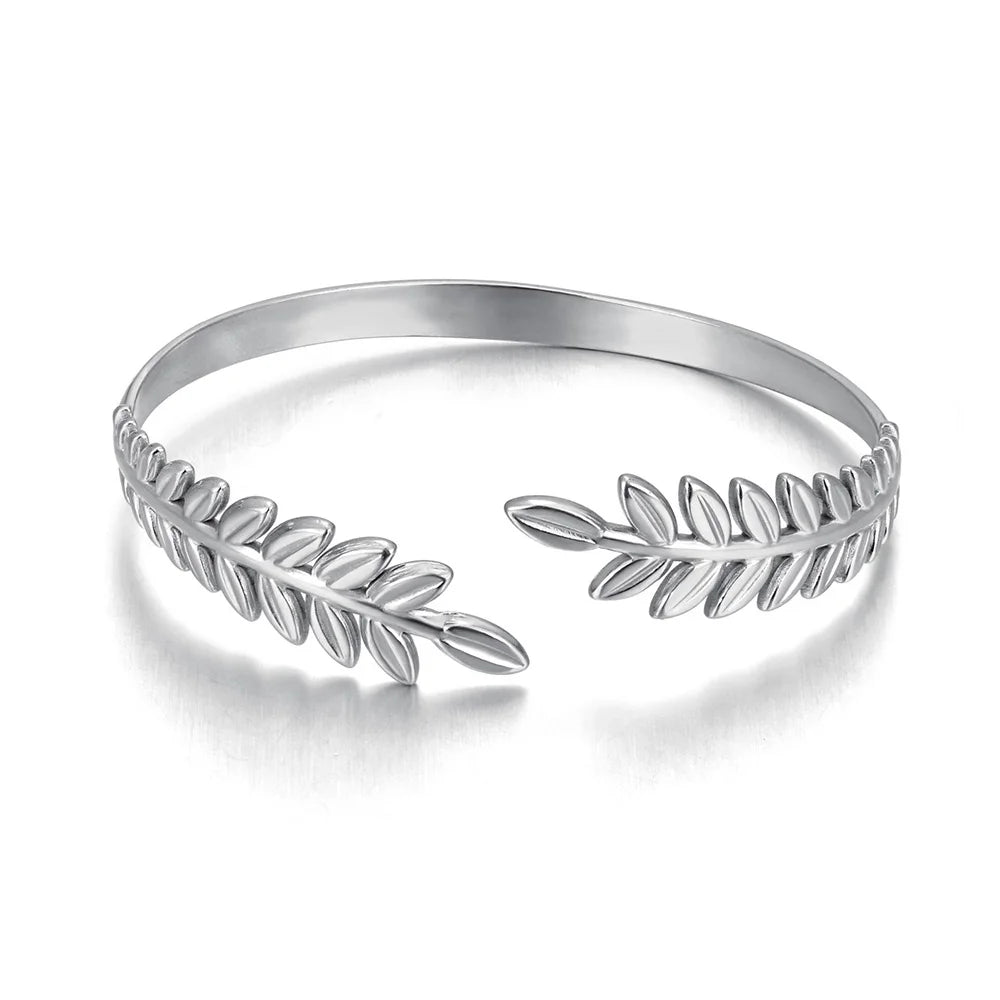 Elevate your style with this fashion stainless steel open charm bracelet. Featuring a stunning golden leaf plant design, this statement piece adds a touch of nature-inspired elegance to any outfit. Durable, waterproof, and crafted for lasting shine, it’s perfect for women who love versatile and eye-catching jewelry. Ideal for daily wear or as a thoughtful gift.