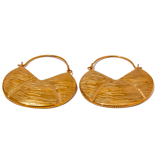 These vintage-inspired hoop earrings are crafted from rust-proof, lightweight stainless steel with an elegant 18K gold plating, offering both durability and a luxurious finish. Their textured surface adds subtle dimension, blending a modern geometric look with timeless appeal. Ideal for those who love understated elegance, these earrings make versatile accessories for any occasion, pairing effortlessly with both casual and dressy styles. 