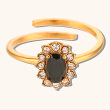 Load image into Gallery viewer, Add a touch of elegance to your look with this luxurious gold plated flower oval zircon ring. Crafted from durable stainless steel, this stunning piece features a sparkling oval zircon centerpiece surrounded by delicate floral details. Perfect for parties or special occasions, it exudes sophistication and charm, making it a must-have accessory for any woman’s jewelry collection.
