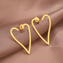 Load image into Gallery viewer, Make a bold statement with these exaggerated heart contour stainless steel stud earrings. Featuring a striking heart-shaped design, these earrings combine modern fashion with timeless elegance. Lightweight and durable, they’re perfect for adding a touch of flair to any outfit. A must-have accessory for women who love unique and stylish jewelry, these earrings are ideal for both everyday wear and special occasions.
