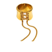 Load image into Gallery viewer, Add a bold yet elegant touch to your everyday style with this tassel wrapped stainless steel women’s Rrng. Featuring a unique wrapped design with trendy tassel detailing, this ring is crafted from durable stainless steel and finished with luxurious PVD gold plating for long-lasting shine. Versatile and fashionable, it’s perfect for daily wear or special occasions and makes a thoughtful gift for women who love modern, multifunctional jewelry.
