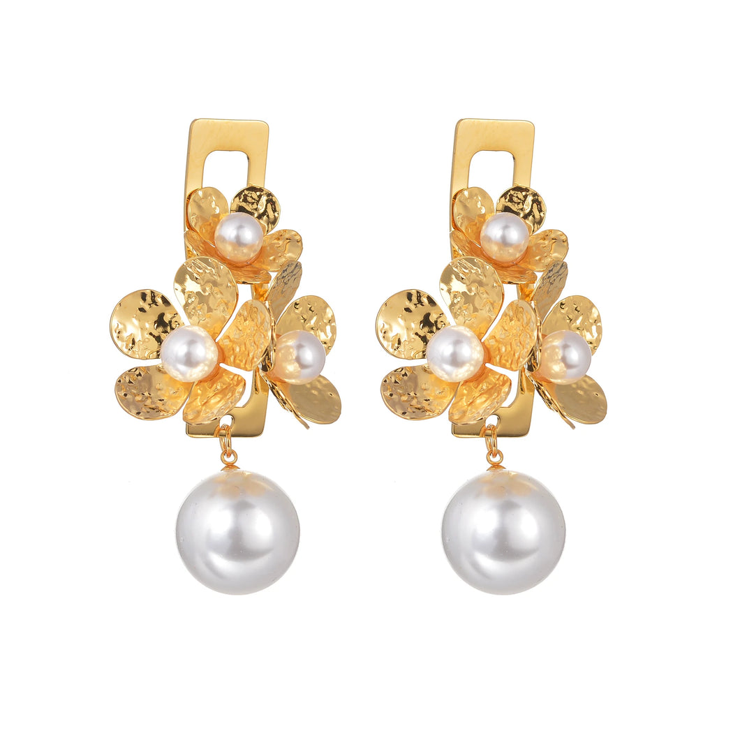 Add a touch of vintage elegance to your look with these stunning statement earrings. Crafted from high-quality stainless steel, they feature three delicate flowers paired with a retro pearls for a timeless and sophisticated charm. Perfect for parties, anniversaries, or any special occasion, these earrings make a beautiful gift for the fashion-forward woman who loves bold yet elegant jewelry.