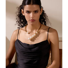 Load image into Gallery viewer, Beautiful statement necklace is made of stainless steel and artificial pearls. The necklace is opened in front and has a row of pearls mixed with stainless steel beads. Pearls are getting bigger and bigger towards the end of the necklace which makes it perfect jewelry piece for your evening gown.
