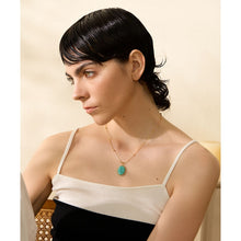 Load image into Gallery viewer, Stainless steel 18K gold plated necklace comes in a gold colour. It is made of a beautiful chain adorned with small balls. It has oval pendant made of natural stone amazonite with nice gold border. The chain necklace is perfect for spicing up your summer outfit. It has lobster clasp and adjustable length.
