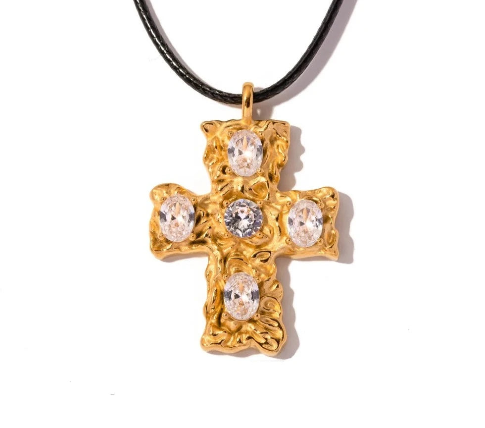 This glam rock necklace is made of stainless steel pendant which is hanging on a black wax rope. The beautiful cross pendant comes in two colours: gold and silver. It has irregular surface which is additionally adorned with 5 big cubic zirconia. It is a perfect piece for any daily occasion as well a great gift for your beloved friend. The necklace has lobster clasp and adjustable chain.