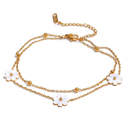 Add a touch of summer romance to your style with this exquisitely crafted gold anklet. Made from high-quality, gold-plated stainless steel, it features a delicate double-chain design. One chain is adorned with dainty gold beads, while the other is beautifully decorated with charming white flowers, creating a perfect balance of elegance and whimsy. With its secure lobster clasp and adjustable length, this anklet is the ideal accessory to enhance your summer look, adding a subtle yet sophisticated touch to yo